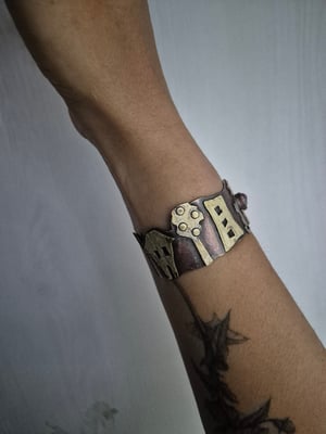 Copper bracelet with trees, houses, cat and star