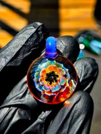 psychedelic sunflower pendant with uv reactive center dots 