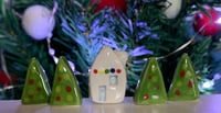Image 5 of Little House with lights and a Christmas Tree.