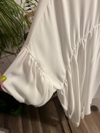 Image 2 of white sheer high /low puff sleeve beaded neck top