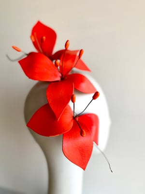 Image of Vibrant orange flower headpiece   