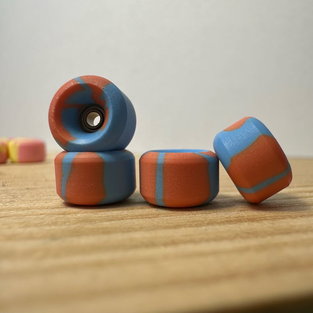 Image of blue/orange swirl wheels 