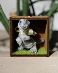 Image 1 of Pipe cleaner velociraptor with wooden modular display