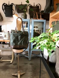 Image 3 of Forest green waxed canvas tote bag / office bag with leather bottom and cross body strap