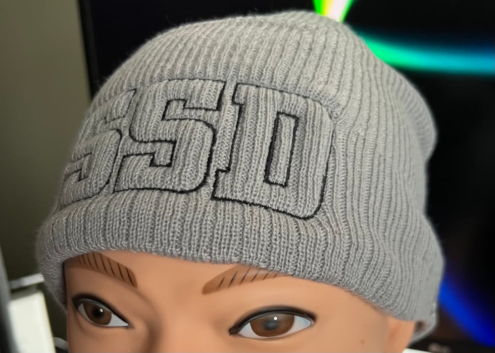 Grey New Era Knit beanie with Black Outline SSD logo 