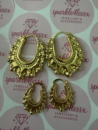 Set of large and medium gold creoles 