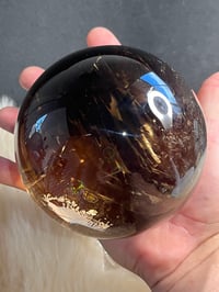 Image 24 of Golden Rutile In Smoky Quartz Sphere #1769