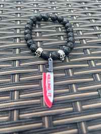 Image 1 of Men’s Halloween bracelet made with lava stone beads and knife charm 