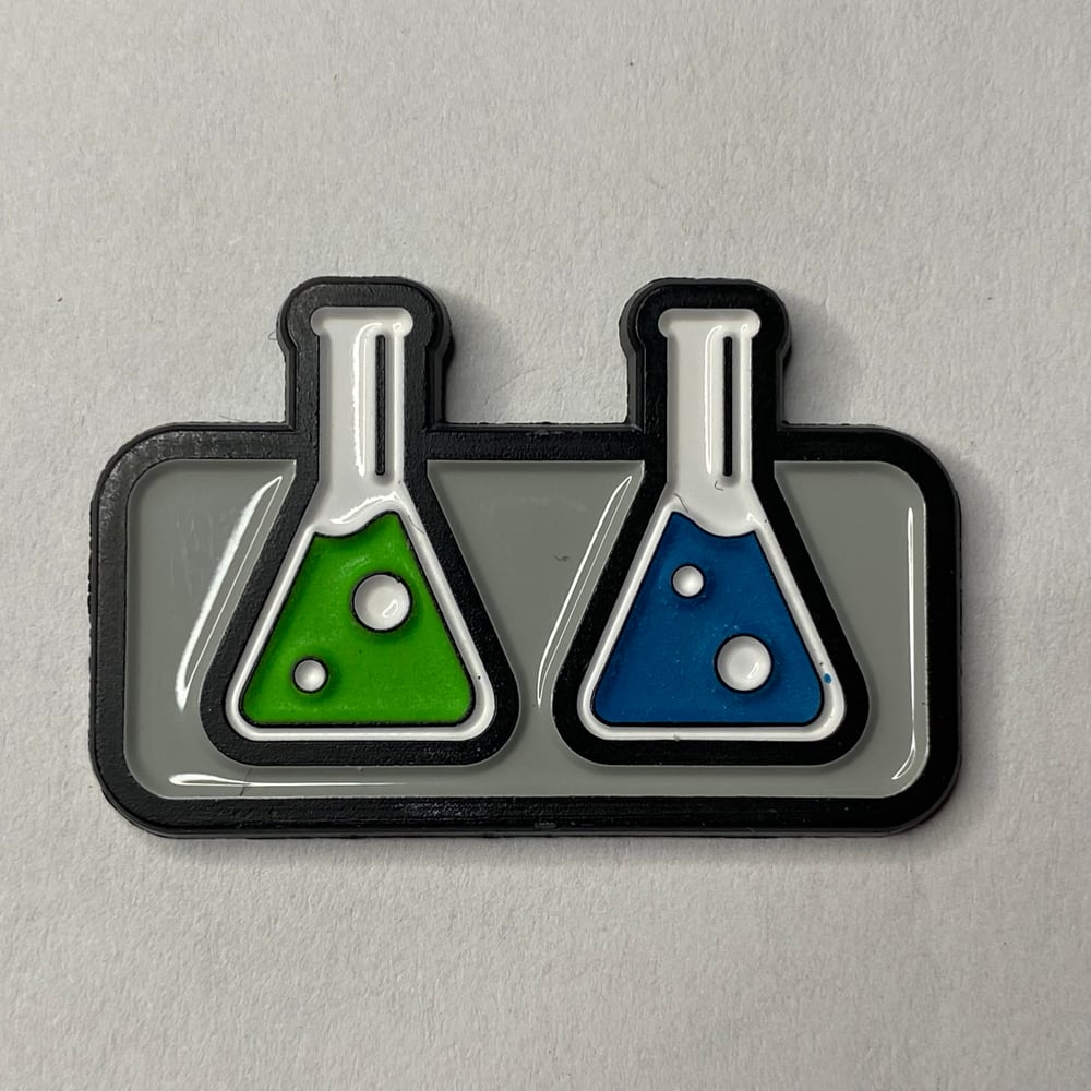 The Capologists Beakers Pin