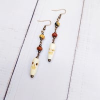 Image 2 of Skull Pendulum Earrings
