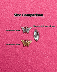 Image 2 of 18k Gold Tramp Stamp Butterfly Tooth Charm