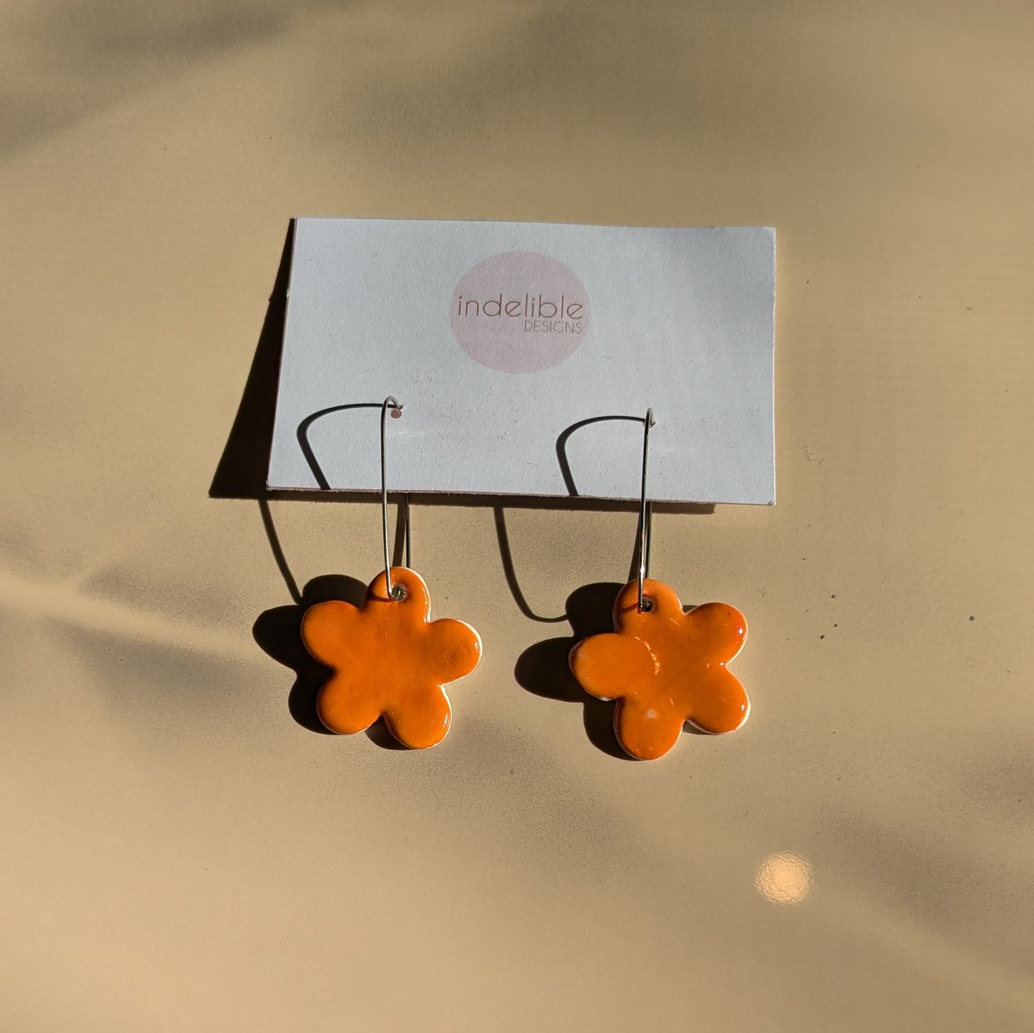 Image of orange daisy earrings