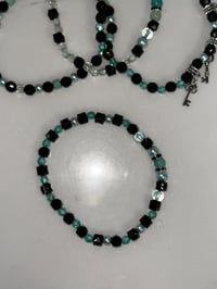 Image 4 of Teal and Black Midnight Glitz’s Tumbler Bracelet Stack