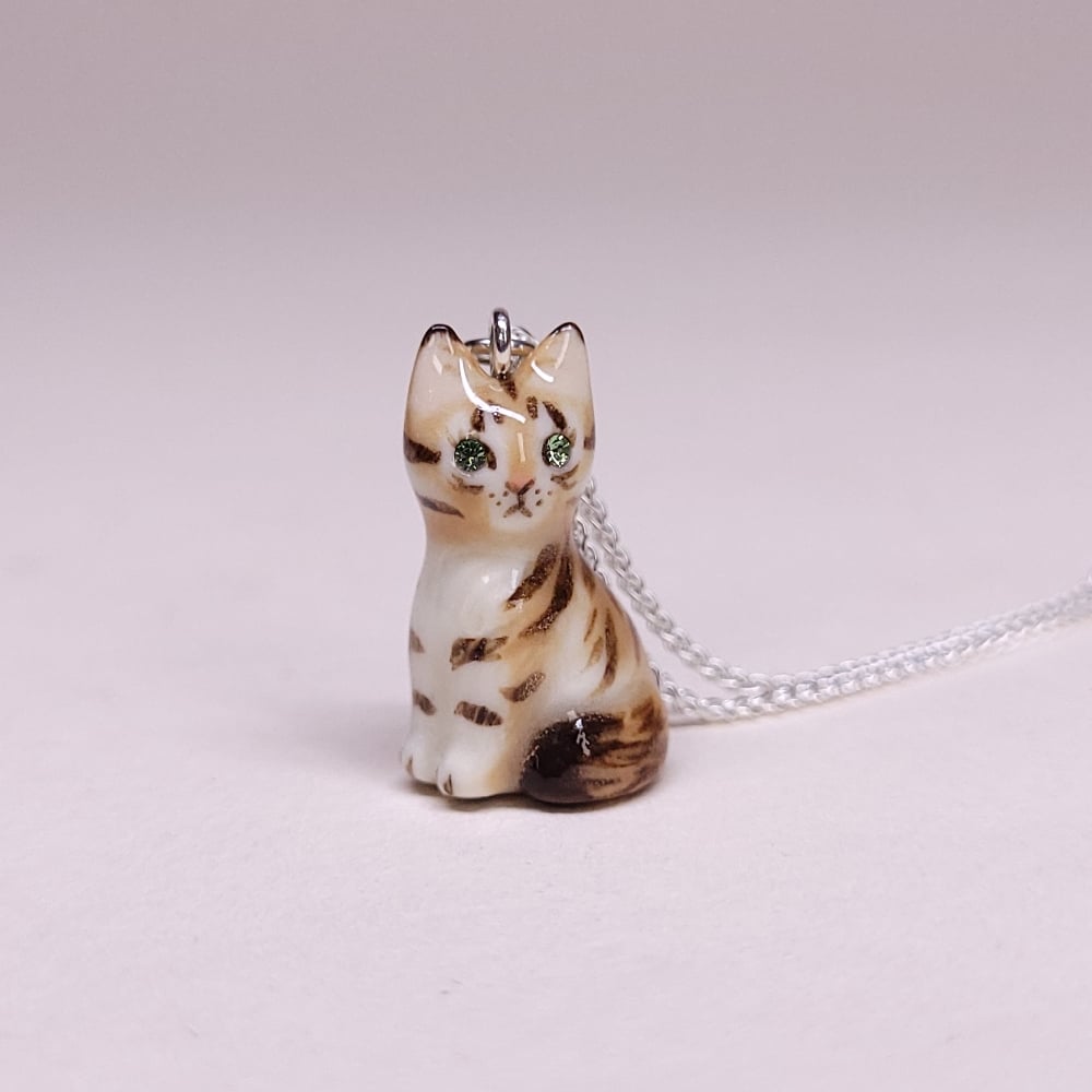 Image of Maine Coon Porcelain & Sterling Silver Sitting Kitten Pendant