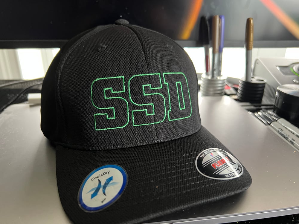 Black Flexfit hat with Green Outline SSD logo with rear “Boston Crew” logo