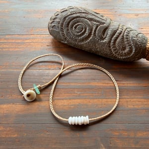 Image of Waterproof 7 tiny pukas choker necklace on hand braided sinew with locking seaglass clasp
