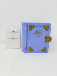 Image 1 of Ensemble bracelet et Polly Pocket Livre violet monde sous-marin.