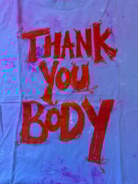 Image 1 of Purple and pink tie dye T shirt with bright orange text (3XL)