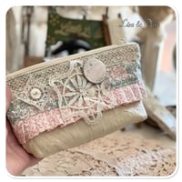 Image 4 of sewing zipper purse and needle book and tiny glass bottle of vintage buttons and French lace