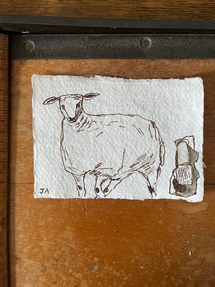Image of Sheep and standing stone 