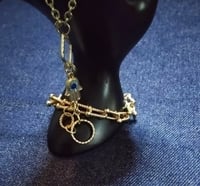 Image 2 of Gold plated slave bracelet with hand charm