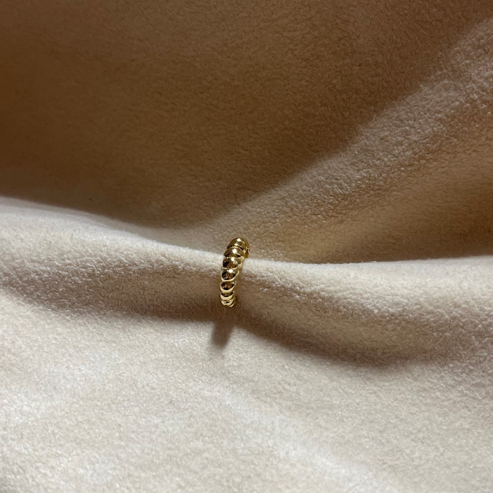 Image of The thin croissant faux nose ring 