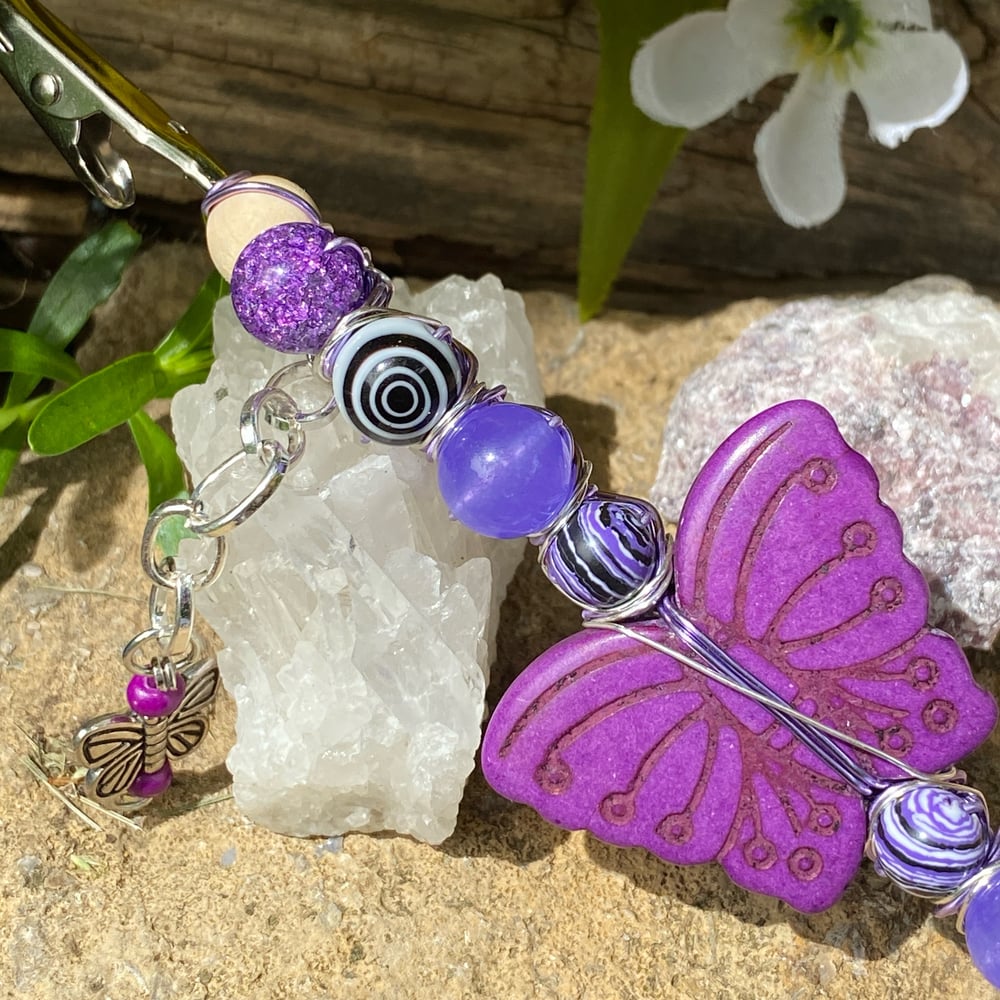 Image of lilac butterfly roach clip 