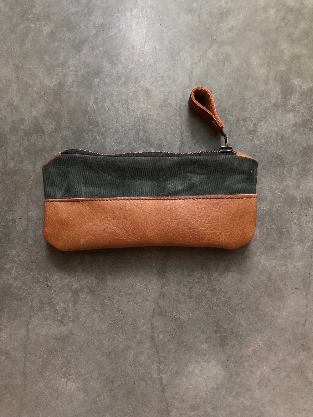Image of Pencil case, zipper pouch in forest green waxed canvas and oiled leather