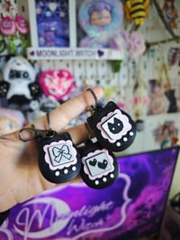 Image 1 of Llavero clicker negro gato