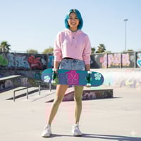 Image 1 of  7 3/4" Skateboard teal with pink and white flowers 