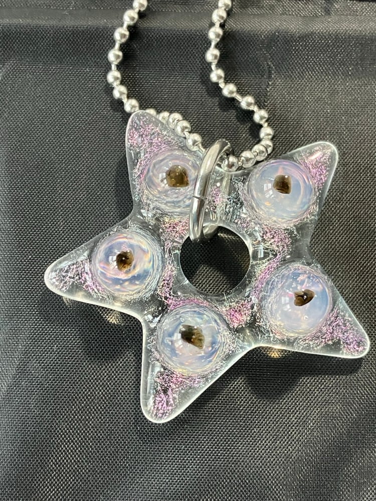 Image of dicro star with tektite incasment (collab with Wallander glass)