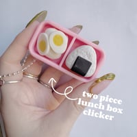 Two piece lunch box clicker