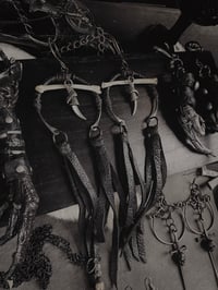 Image 1 of Claws, bones & leather hangers 