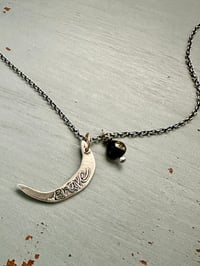 Image 6 of sterling silver moon pendant with brave inscription and green tourmaline