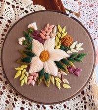 Image 1 of 6” White floral embroidery with green leaves on brown fabric 