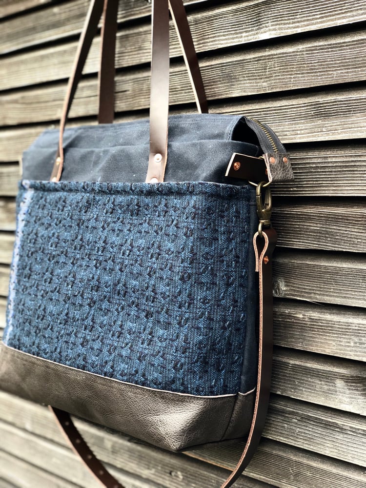 Image of Black Waxed canvas carryall with handwoven exterior pocket 