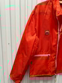 Image 2 of VINTAGE ORANGE WINDBREAKER US BOMBS PIN OG