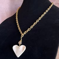 Image 2 of pink conch heart on gold chain