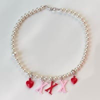 Image 1 of Triple X