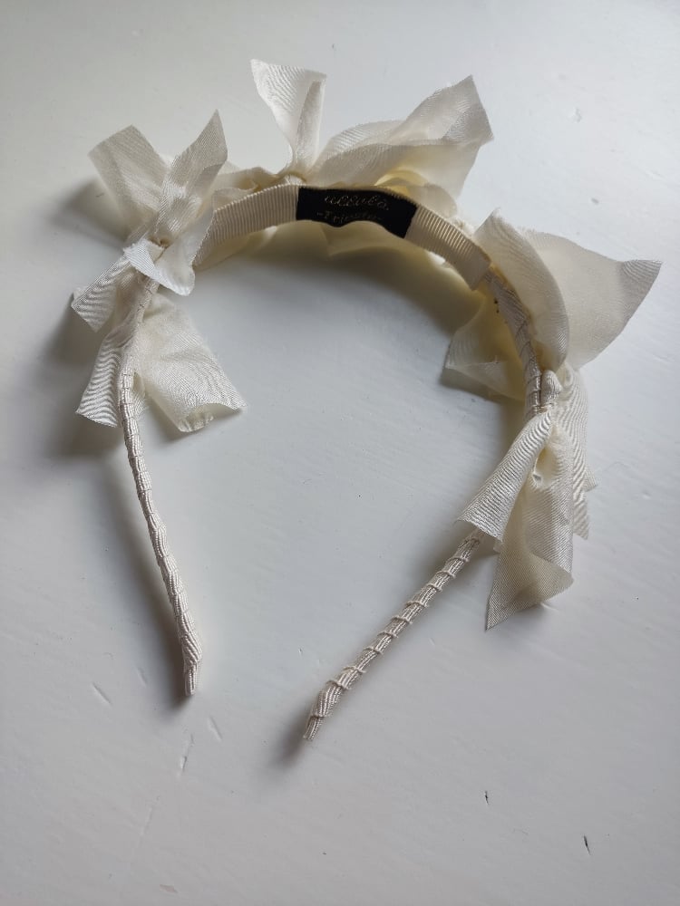 Image of Cerchietto romantico fiocchi avorio 