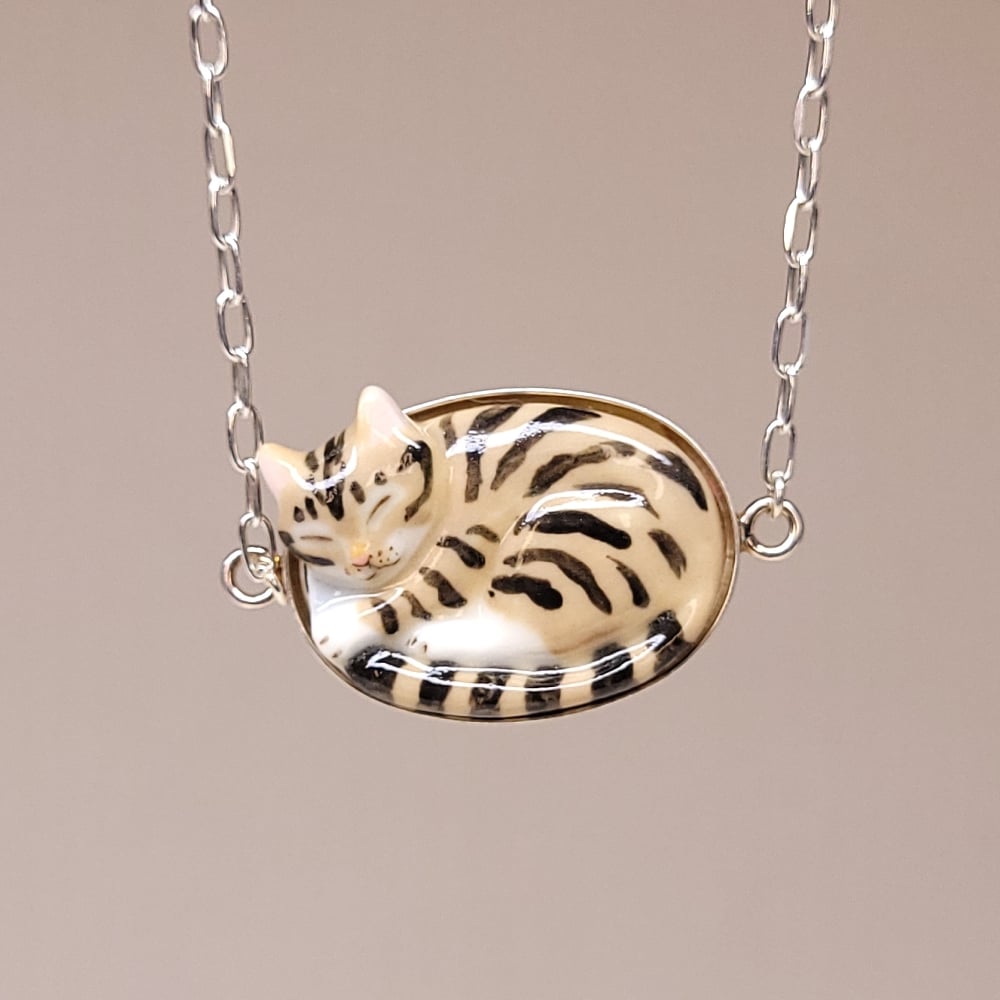 Image of Brown Tabby Porcelain & Sterling Silver Sleeping Kitten Pendant
