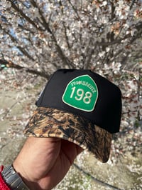 Image 1 of 198 Black and camo Snap back 