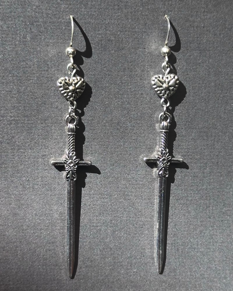 Image of silver sword dangles