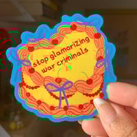 "Stop Glamorizing War Criminals" Cake Sticker