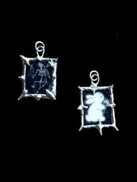 Image of bat skeleton and bunny pendants