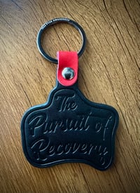 Image 1 of “The Pursuit of Recovery” Leather Embossed Keyring 