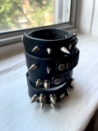 Image 2 of bite me and pierced leather cuffs