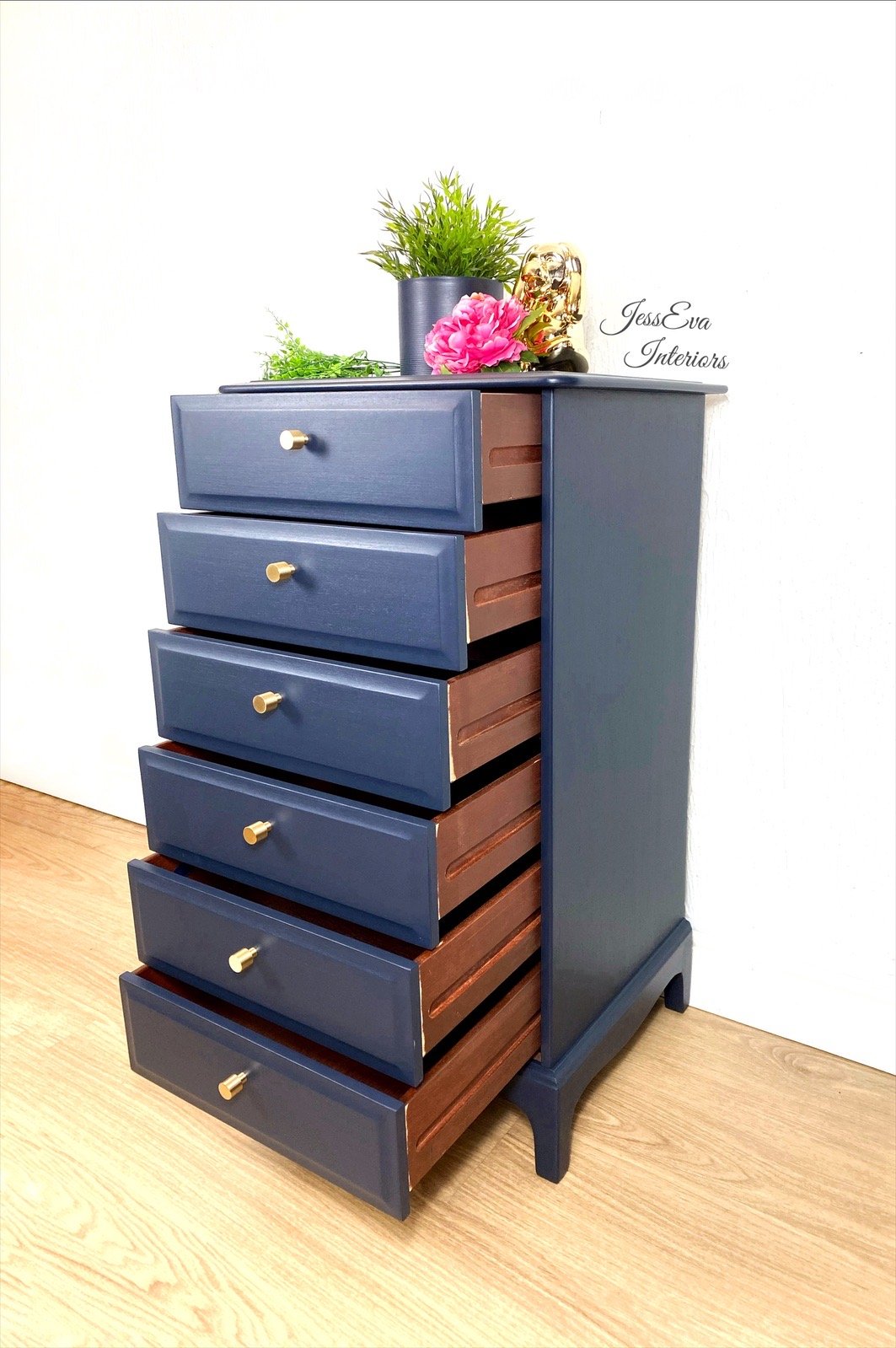 Stag Minstrel Tallboy / Chest Of Drawers painted in navy blue.