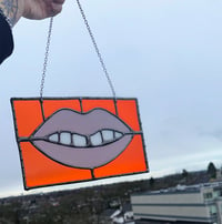 Image 2 of Orange and lavender glass lips 