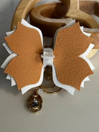 Image 4 of Starlight Shimmer Cream and Gold Sun, Moon, and Star Tumbler Straw Topper Bow
